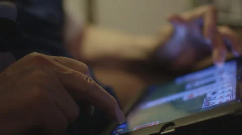 Elderly man's hands while on iPad Stock Footage 37345196