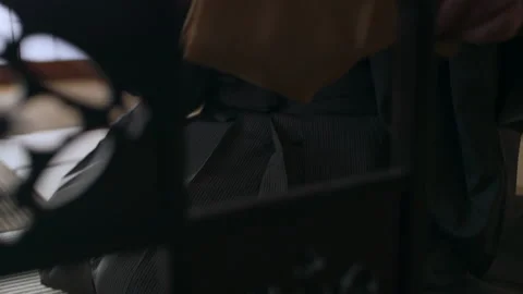 Elderly master preparing a bowl of tea during a historic tea ceremony in a tradi Stock Footage 199459309