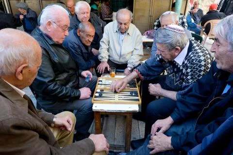 Elderly men play backgammon in Jerusalem, Israel Stock Photos