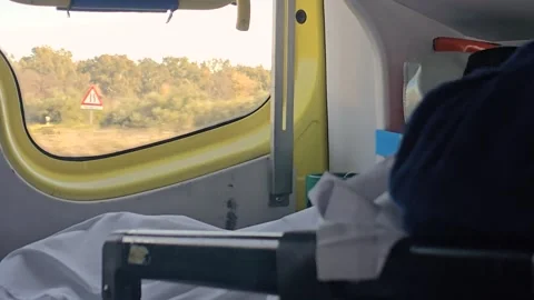 Elderly Patient on Stretcher Inside Moving Ambulance Stock Footage 337187529