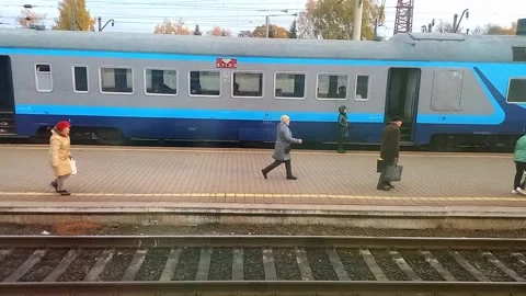 Elderly people are in hurry, running along platform to board train. Stock Footage 291891253