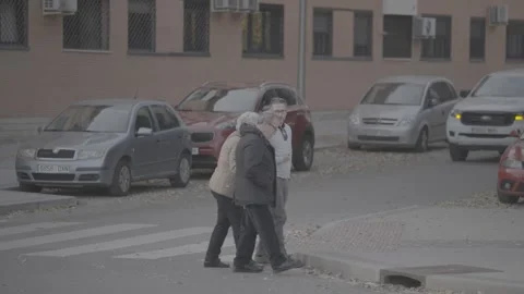 Elderly people are walking down the street in Madrid, Spain Stock Footage 345027138