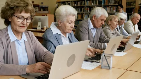 Elderly People Learning to Use Computers Stock Footage 99260079