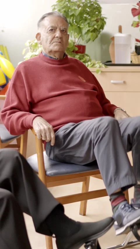 Elderly people pedaling while sitting in a nursing home Stock Footage 269761615