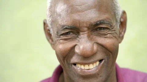 Elderly people portrait, happy old black man smiling at camera Stock Footage