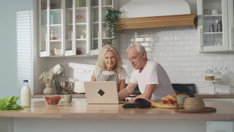 Elderly people use modern technology, portrait of old man and woman with laptop Stock Footage 311151339