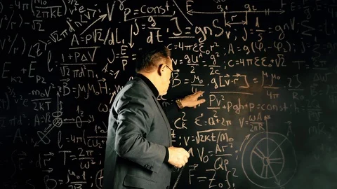 Elderly professor giving a lecture, mathematical formula on blackboard Stock Footage 128984002