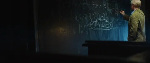 Elderly Professor or scientist working, writing formula with chalk on blackboard Stock Footage 123277674