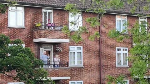 ELDERLY RESIDENTS CLAPPING FOR ESSENTIAL WORKERS DURING COVID-19 UK LOCKDOWN, 4K Stock-Footage 130346213