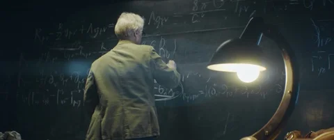 Elderly scientist or Professor is working or researching something late at night Stock Footage 123126660