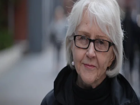 Elderly senior caucasian woman in city face portrait serious Stock Footage