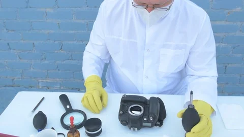 Elderly solid person in white dressing gown, cap, medical mask, glasses clean Stock Footage 93428817