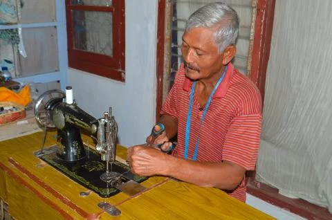 Elderly Tailor Cutting Thread Before Threading Machine Needle Stock Photos