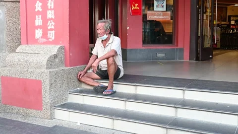 An elderly is taking a rest Stock Footage 204765653