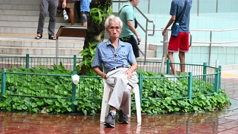 An elderly is taking a rest Stock Footage 234798639