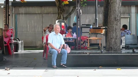 An elderly is taking a rest Stock Footage 240381895