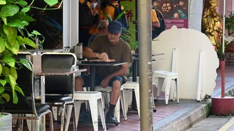 An elderly is taking a rest Stock Footage 240382633