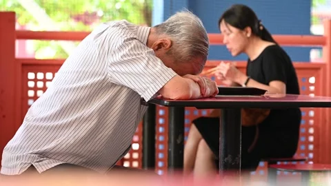 An elderly is taking a rest Stock Footage 240383701