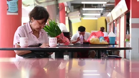 An elderly is taking a rest Stock Footage 240384180