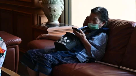 An elderly is taking a rest Video stock 240387713