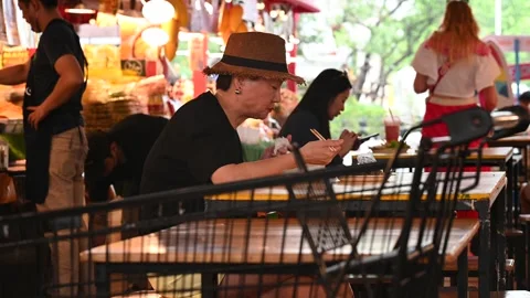 An elderly is taking a rest Stock Footage 240401983