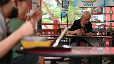 An elderly is taking a rest Stock Footage 240410339