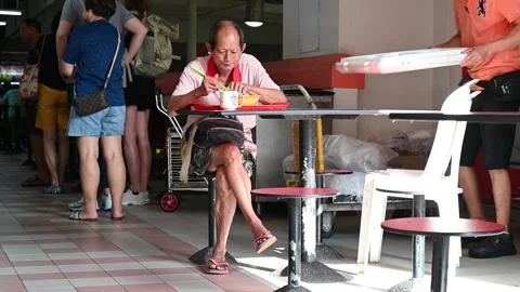 An elderly is taking a rest Stock Footage 240410343