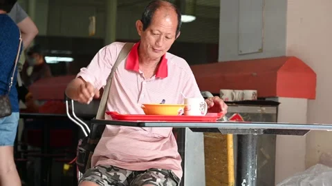 An elderly is taking a rest Stock Footage 240410349