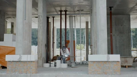Elderly welder working at a construction site Stock Footage 302775625