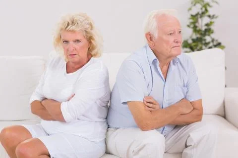 Elderly woman being angry against a man Stock Photos