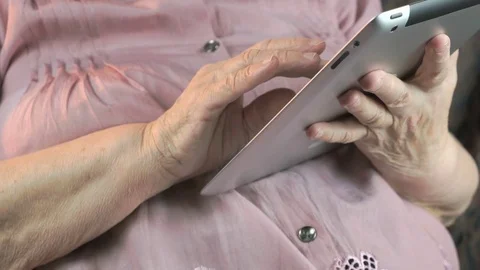 Elderly woman with digital tablet computer indoors Vídeo Stock 70253245