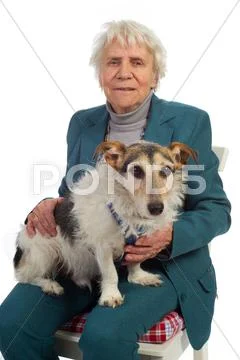 Elderly woman with dog Stock Photos