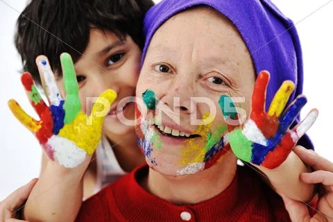Elderly woman grandmother with painted face over white background Stock Photos