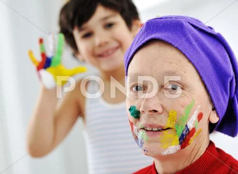 Elderly woman grandmother with painted face over white background Stock Photos