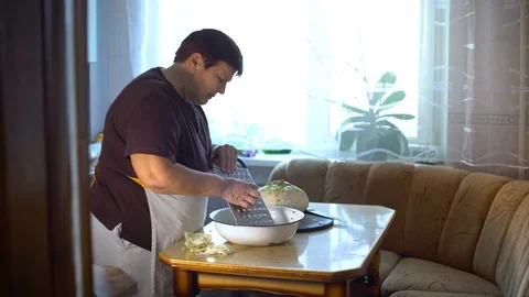 Elderly woman grating cabbage while cooking vegetarian meal Stock Footage 101301805