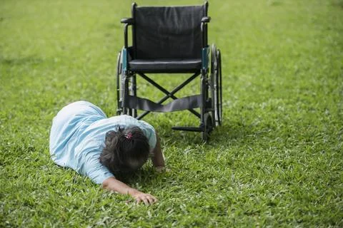 Elderly woman need help after accident from a wheelchair. Stock Photos