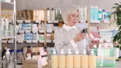 Elderly woman scanning qr code of pills Stock-Footage 346120308
