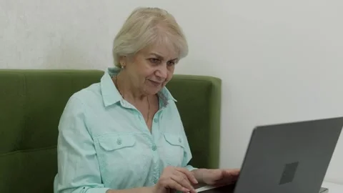 Elderly woman using laptop computer montage Stock Footage 321855928
