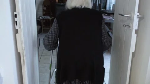 Elderly woman walking using a walker 스톡 동영상 144658689
