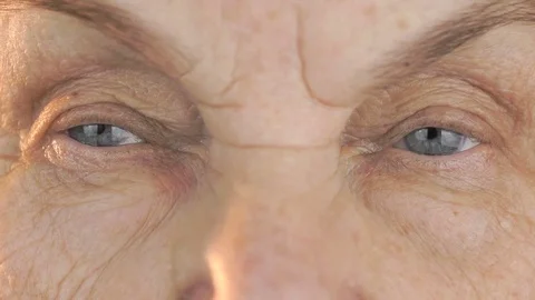 Elderly woman's face with tired expression of face 動画素材 70534253