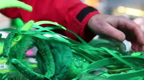 Elderly woman's hand arranging green props on counter Stock Footage 61743822