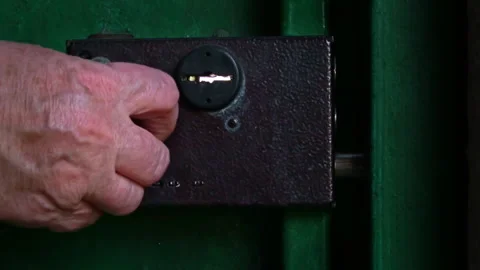 Elderly Woman's Hand Closes the Lock Latch Close-up Stock Footage 252176799