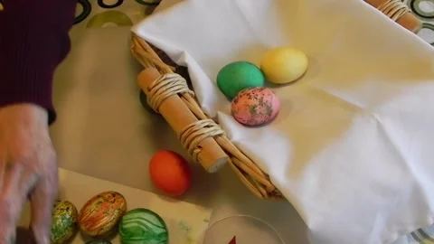 Elderly Woman's Hand Place Easter Eggs In Basket Stock Footage 150268485