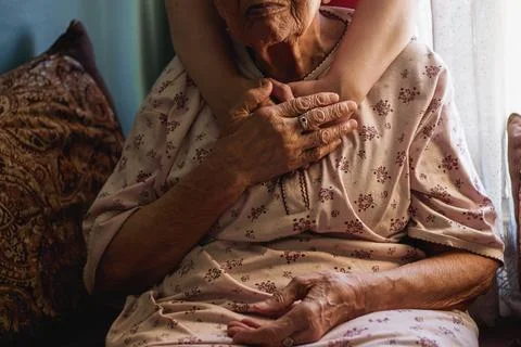 Elderly Woman's Hands Being Held Comfortingly in a Close Atmosphere Stock Photos