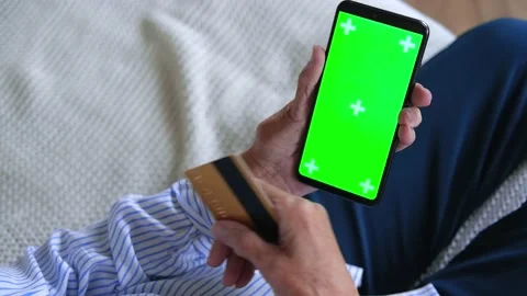 Elderly womans hands closeup using tablet holding credit card buy on internet Video stock 159863159