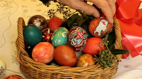 Elderly women putting Easter eggs into the basket  Stock Footage 35782850