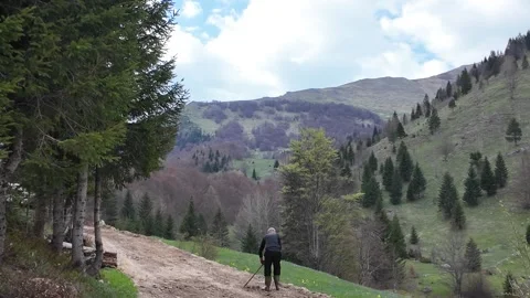An elderly worker in the mountains. Stock Footage 317640143