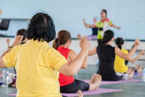 Elderly in a yoga exercise posture Stock Photos