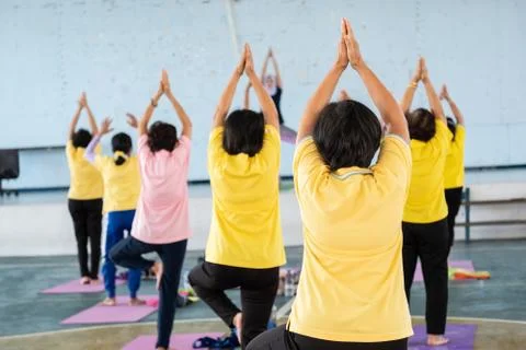 Elderly in a yoga exercise posture Stock Photos