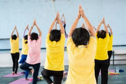 Elderly in a yoga exercise posture Stock Photos
